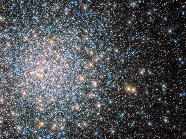 Globular cluster M13 in Hercules — hundreds of thousands of ancient stars resolved into a tight spherical swarm.