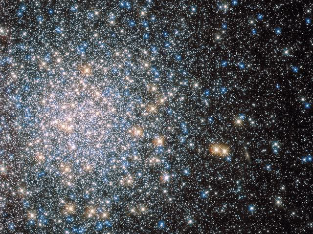 Globular cluster M13 in Hercules — hundreds of thousands of ancient stars resolved into a tight spherical swarm.